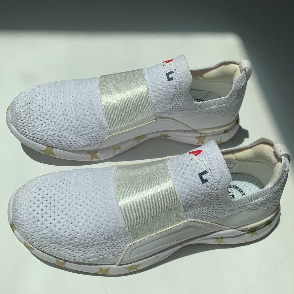 APL white slip-on sneakers with gold stars, size 7.5